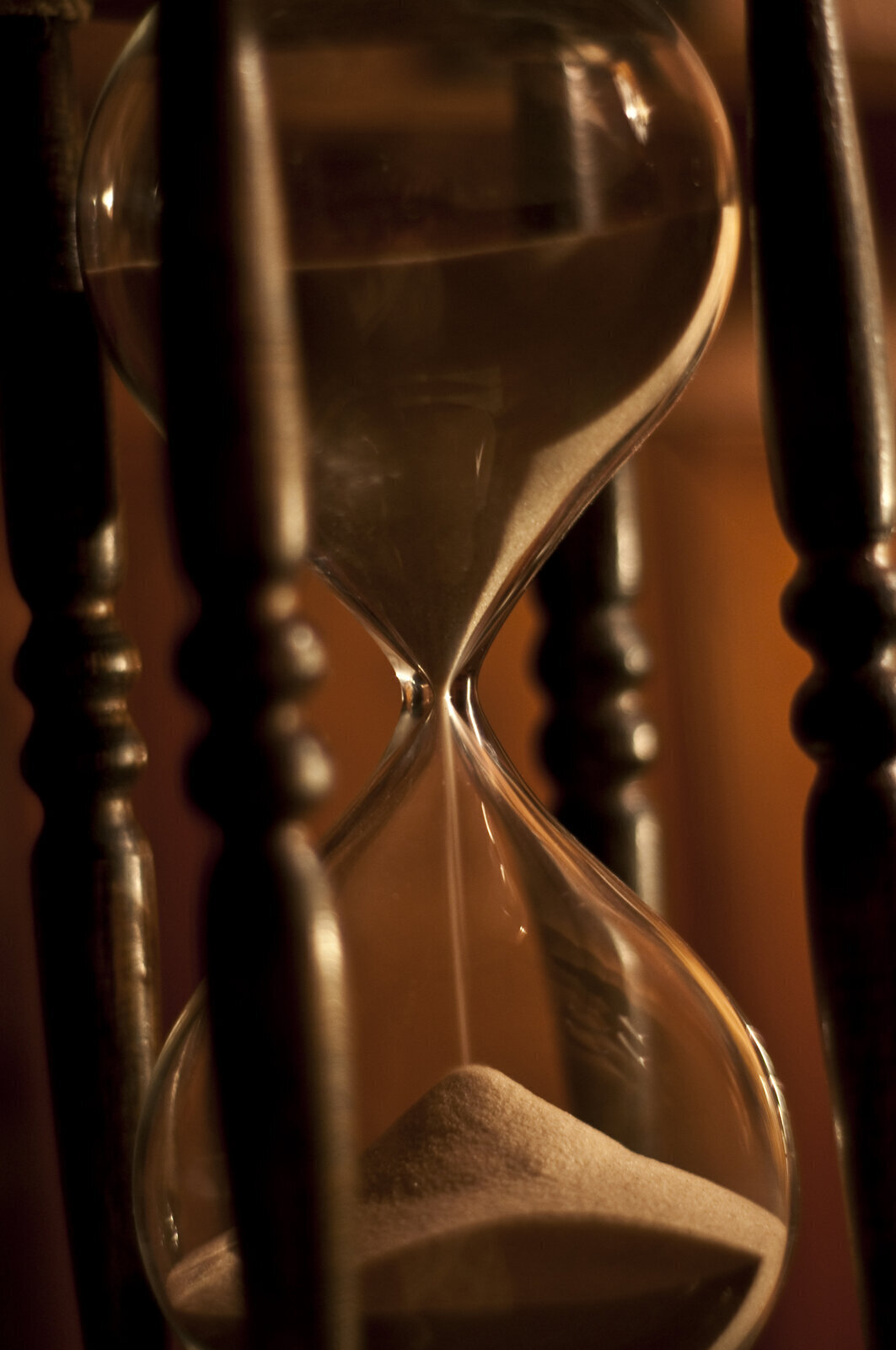 An hourglass with sand falling